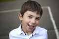 Preteen smiling boy outdoor closeup portrait Royalty Free Stock Photo