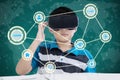 Preteen student studying with virtual screen