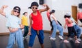 Preteen white girl and afro boy breakdancers in dance studio Royalty Free Stock Photo