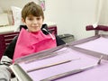 Preteen young boy visiting dentist, having his teeth checked by dentist in dental office. Happy teenager without fear. Royalty Free Stock Photo