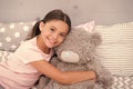 Pretend friend. Happy kid cuddle teddy bear. Little girl smile with toy friend. Friend and friendship. Adoption and Royalty Free Stock Photo