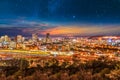 Pretoria city lit up at night with twilight and stars in the sky