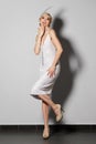 Pretty actress in pearl white retro dress dancing charleston Royalty Free Stock Photo