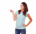 Pretty adult woman pointing to her right Royalty Free Stock Photo