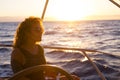 Pretty adult woman on the yacht in luxury relax lifestyle enjoying the tour travel and blue ocean - female people look at the