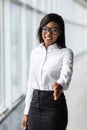 A pretty african american business woman offering a handshake in office Royalty Free Stock Photo