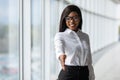 A pretty african american business woman offering a handshake in office Royalty Free Stock Photo