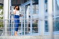 A pretty African american business woman talking on a cell phone at office building Royalty Free Stock Photo