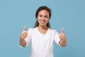 Pretty african american doctor woman isolated on blue background in studio. Female doctor in white medical gown showing Royalty Free Stock Photo