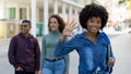 Pretty african american female student with backpack and group of international students Royalty Free Stock Photo