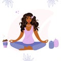 Pretty african american woman meditating in lotus position at home. A beautiful girl, a woman in a pink t-shirt is doing