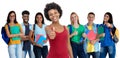 Pretty african american young adult woman with large group of international students Royalty Free Stock Photo