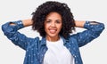 Pretty African American young woman dressed in white t-shirt and blue blouse, holding hands on head, feeling happy. Royalty Free Stock Photo