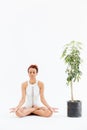 Pretty african american young woman meditating and practicing yoga