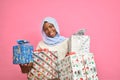 pretty african girl holding plenty gift boxes feeling excited and happy Royalty Free Stock Photo