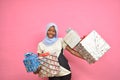 pretty african girl holding plenty gift boxes feeling excited and happy Royalty Free Stock Photo