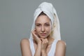 Pretty beautiful girl with perfect clean skin in a towel tenderness posing with happy smile on white background Royalty Free Stock Photo