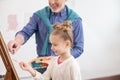 Pretty artistic family is painting together Royalty Free Stock Photo