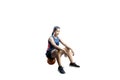 Pretty asian basketball player woman sitting on the basketball Royalty Free Stock Photo