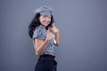 pretty asian ethnic woman giving a thumbs up smiling ok sign and isolated on gray background Royalty Free Stock Photo