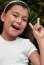 Cute Philippina Juvenile And Peace Sign Closeup