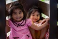 Pretty asian identical twins while enjoying and playing on a playground Royalty Free Stock Photo