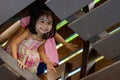 Pretty asian identical twins while enjoying and playing on a playground Royalty Free Stock Photo