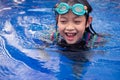 Pretty asian little girl in swimming pool Royalty Free Stock Photo
