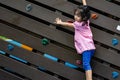 Pretty asian little girls while climbing in a playground Royalty Free Stock Photo