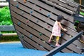 Pretty asian little girls while climbing in a playground Royalty Free Stock Photo