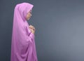 Pretty asian muslim woman with veil praying Royalty Free Stock Photo