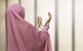 Pretty asian muslim woman wearing raising hand and praying Royalty Free Stock Photo