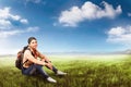 Pretty asian tourist woman with backpack relaxing and sitting Royalty Free Stock Photo