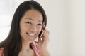 Pretty Asian woman on cell phone Royalty Free Stock Photo