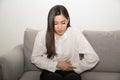 Asian woman having painful stomachache,Female suffering from abdominal pain.