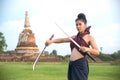 Pretty Asian woman posing in Thai ancient warriors dresses.