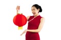 Pretty asian woman in red dress chinese hair style holding paper chinese lantern isolated white background Royalty Free Stock Photo