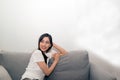 Asian woman relaxed and resting breathing fresh on sofa. Royalty Free Stock Photo