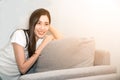 Asian woman relaxed and resting breathing fresh on sofa at home. Royalty Free Stock Photo