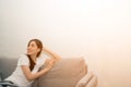 Asian woman relaxed and resting breathing fresh on sofa. Royalty Free Stock Photo