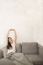 Asian woman relaxed and resting breathing fresh on sofa. Royalty Free Stock Photo