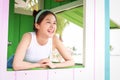 Pretty asian woman smiling happy inside toy wooden house Royalty Free Stock Photo