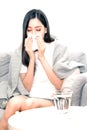 Asian women with stress that suffer from allergies and close the nose with tissue paper. Because of having sneezing all the time.