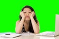 Pretty asian woman student overworked on her laptop on green screen croma key Royalty Free Stock Photo