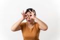 The pretty Asian young woman with surprise and shocked facial expression standing on a white background Royalty Free Stock Photo