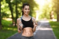 Pretty Athletic Asian Girl Exercising With Skipping Rope In Park, Training Outdoors Royalty Free Stock Photo