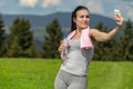 Pretty atlethic woman taking selfie in nature Royalty Free Stock Photo