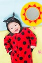 Pretty baby girl, dressed in ladybug costume Royalty Free Stock Photo