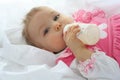 Pretty baby girl is drinking milk Royalty Free Stock Photo