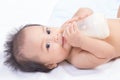 Pretty baby girl drinking milk Royalty Free Stock Photo